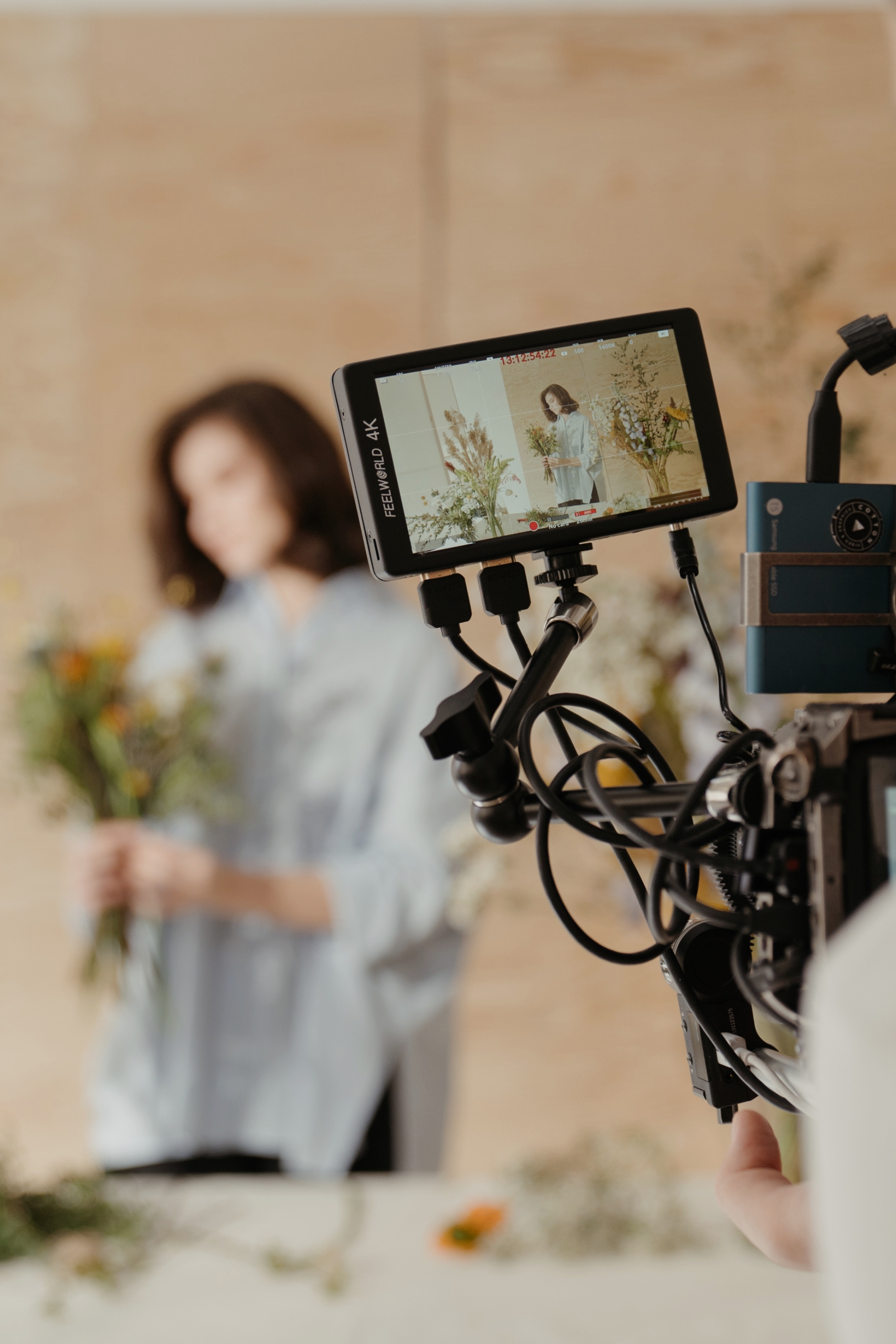 A woman being filmed, demonstrating digital marketing expertise in video content creation.